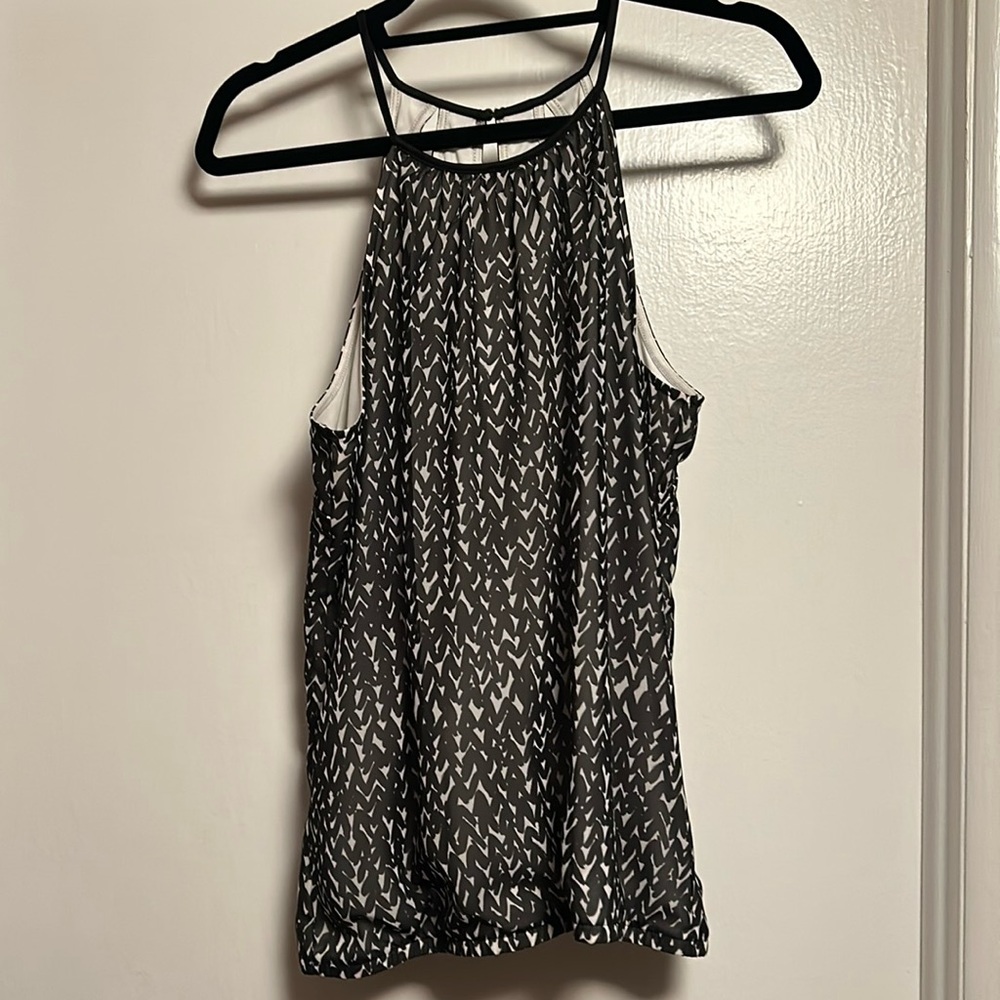 Brand new with tags Express black and white dressy tank. Size Medium